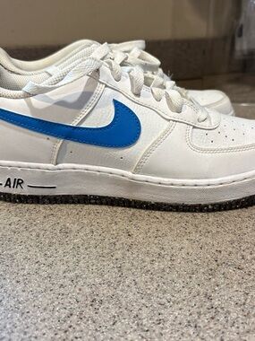 Nike White Low-Top Sneaker with Bright Blue Swoosh